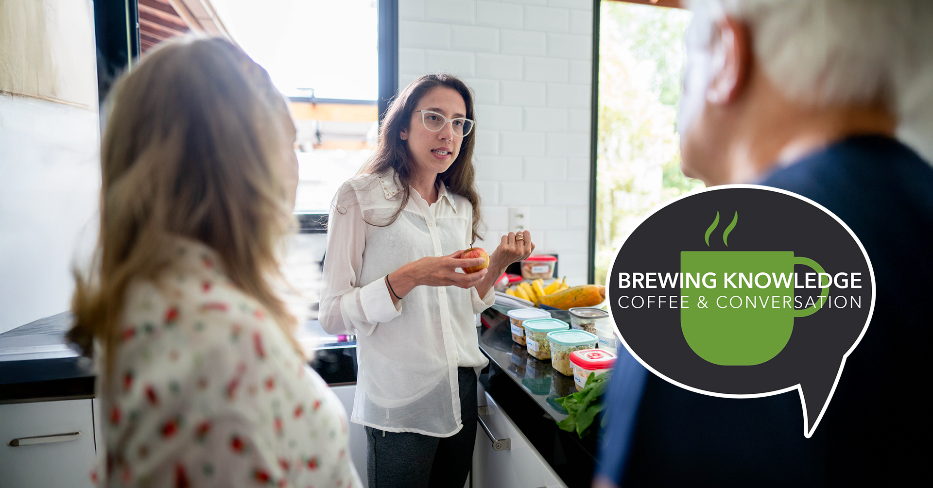 Dietitian doing a healthy cooking consultation with an older couple
